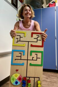 Stacia Hang poses with Sensory Wall panel